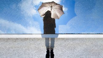 A  girl with umbrella reflected