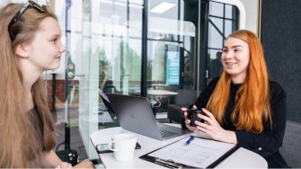 Two girls studying