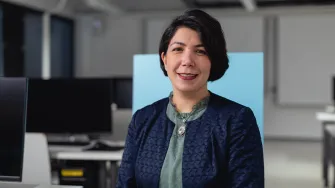 LAB's Senior Lecturer Malahat Ghoreishi sitting in a computer classroom