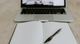 Online meeting and a notebook.