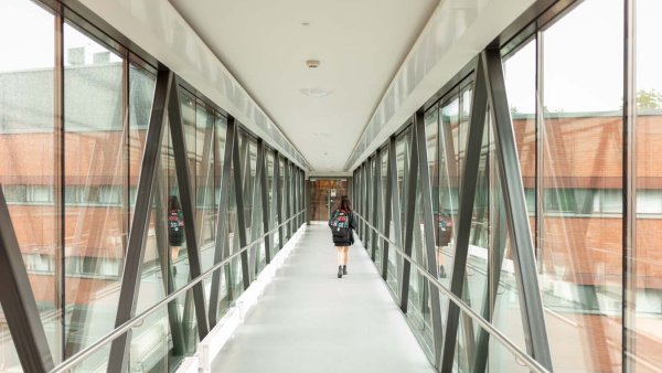A student walking down the hallway on Lappeenranta Campus