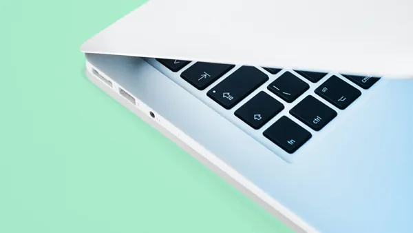 Laptop on a light greeb background.