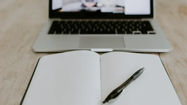 Online meeting and a notebook.