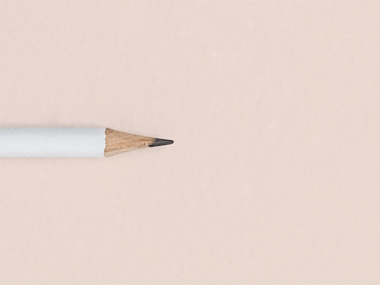 Pencil on light beige background 