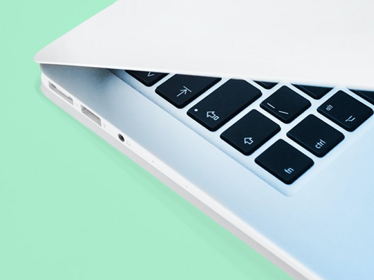 Laptop on a light greeb background.