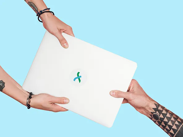 Tattooed people pulling laptop on a light blue background.