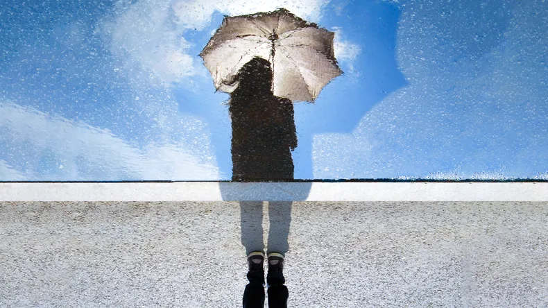 A  girl with umbrella reflected