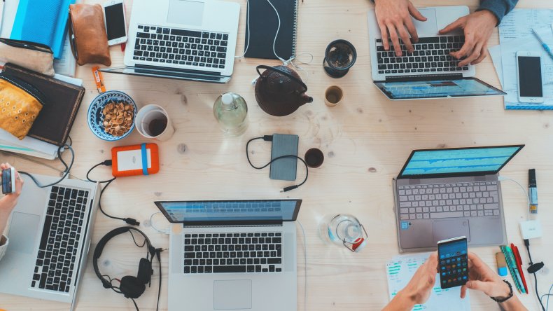 People working together around the table with computers