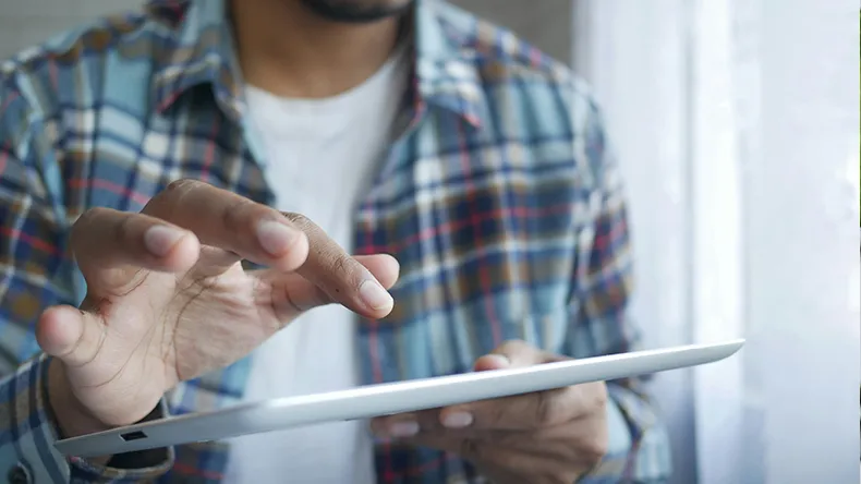 Hands on iPad tablet.