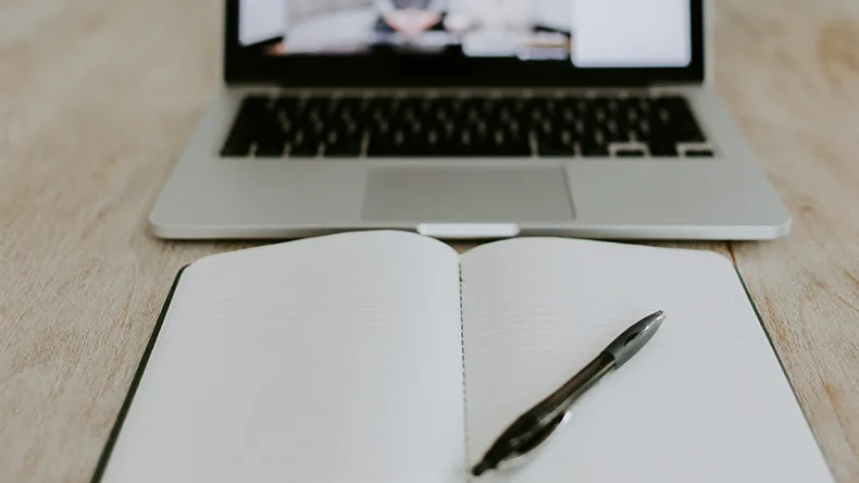 Online meeting and a notebook.